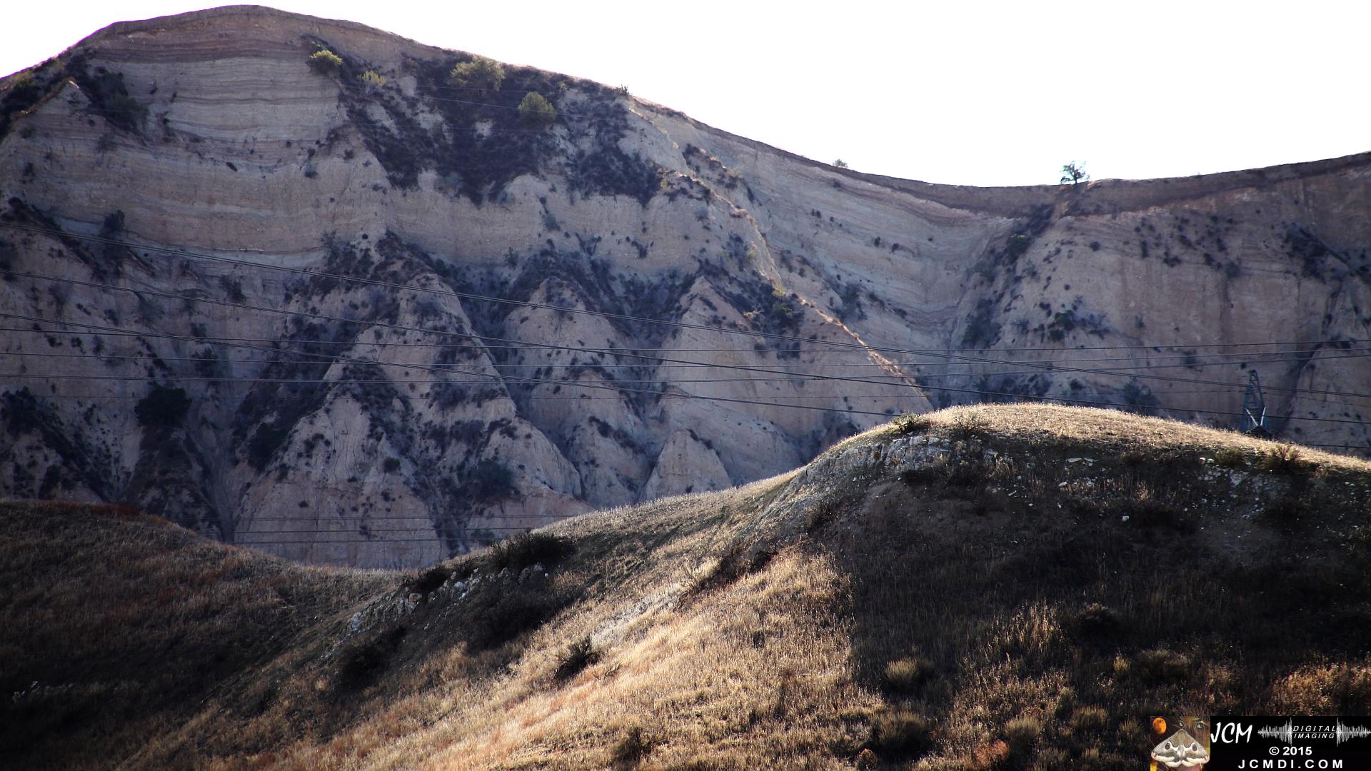 Landslide, buckled pavement, and terrain at Vasquez Canyon Road in Santa Clarita, CA filmed 11-25-2015